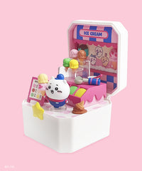 Toy figure of a character in an ice cream shop set on a pink background